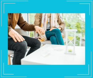 Couple holding hands while at a therapy session. 