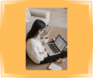 Woman preparing for divorce mediation. Woman sitting on floor with laptop in her lap preparing to do work. 