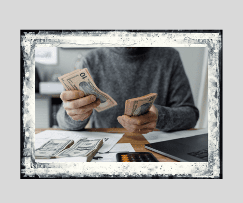 Man counting out bills to signify men and finances during divorce. 